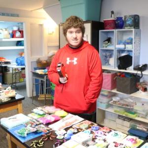 A student works in our vocational program as School Store Clerk